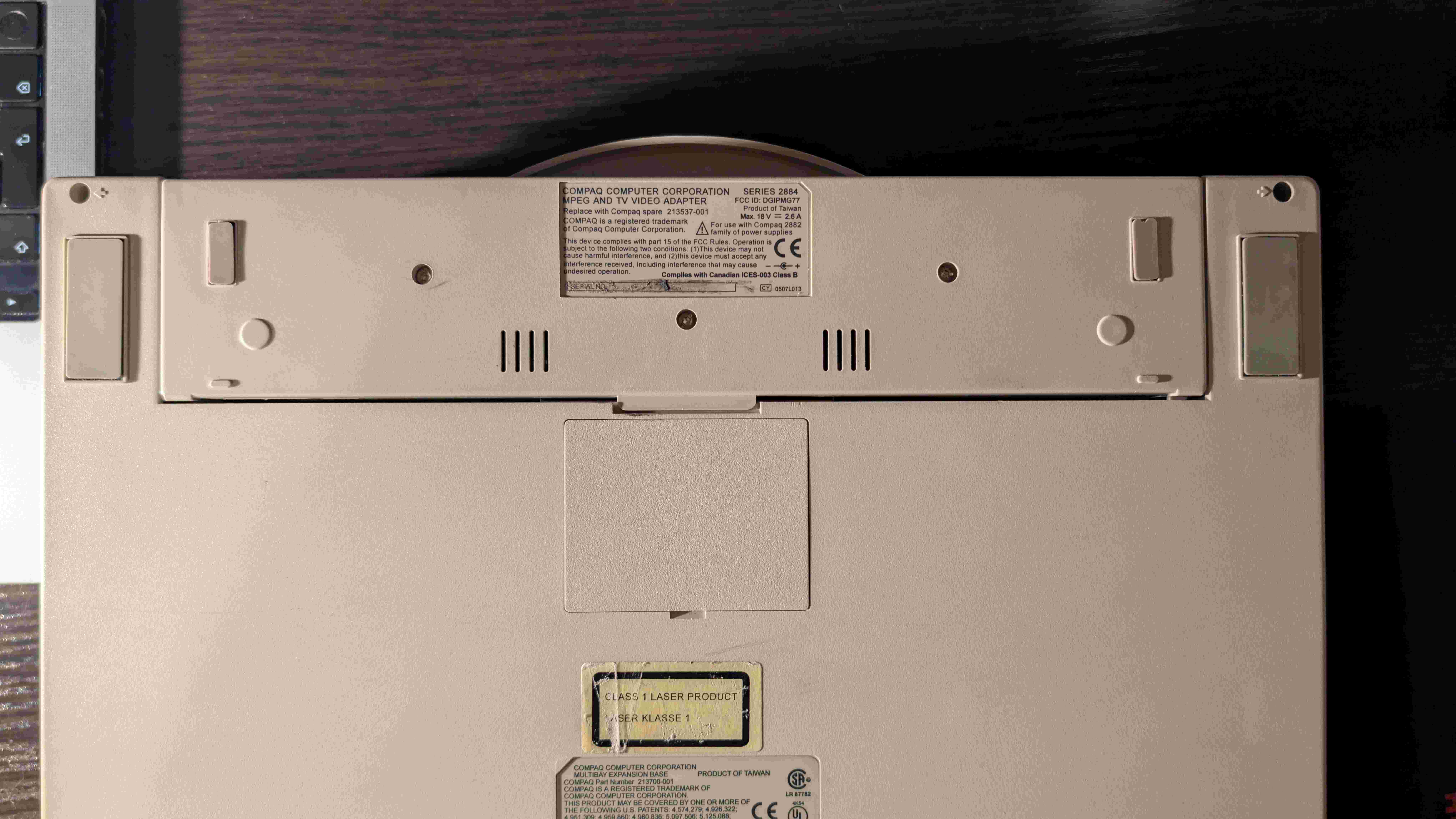 Bottom view of the Compaq docking station with its proprietary MPEG connector visible