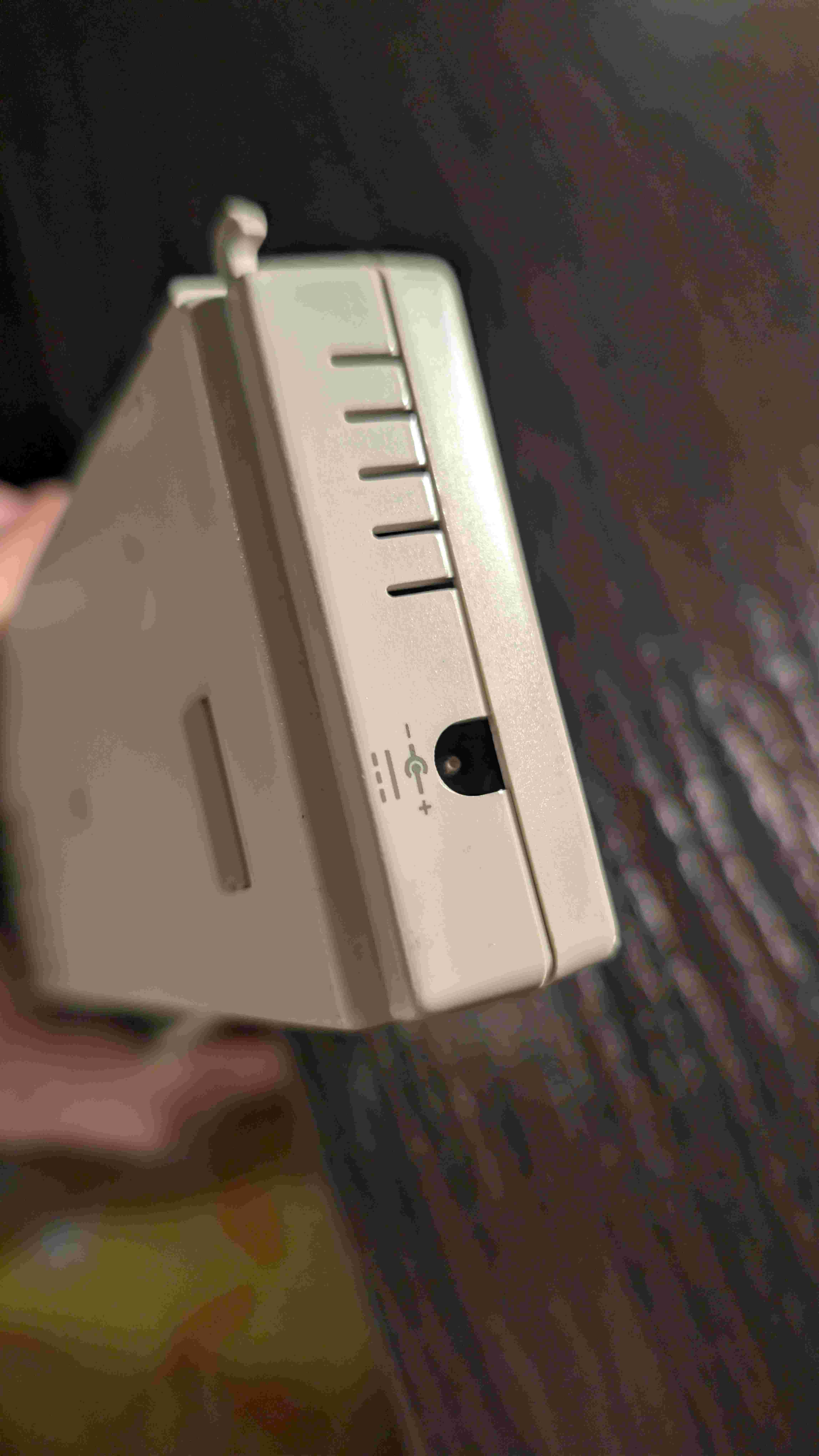 Side view of the adapter showing the power port with positive inside, negative outside polarity