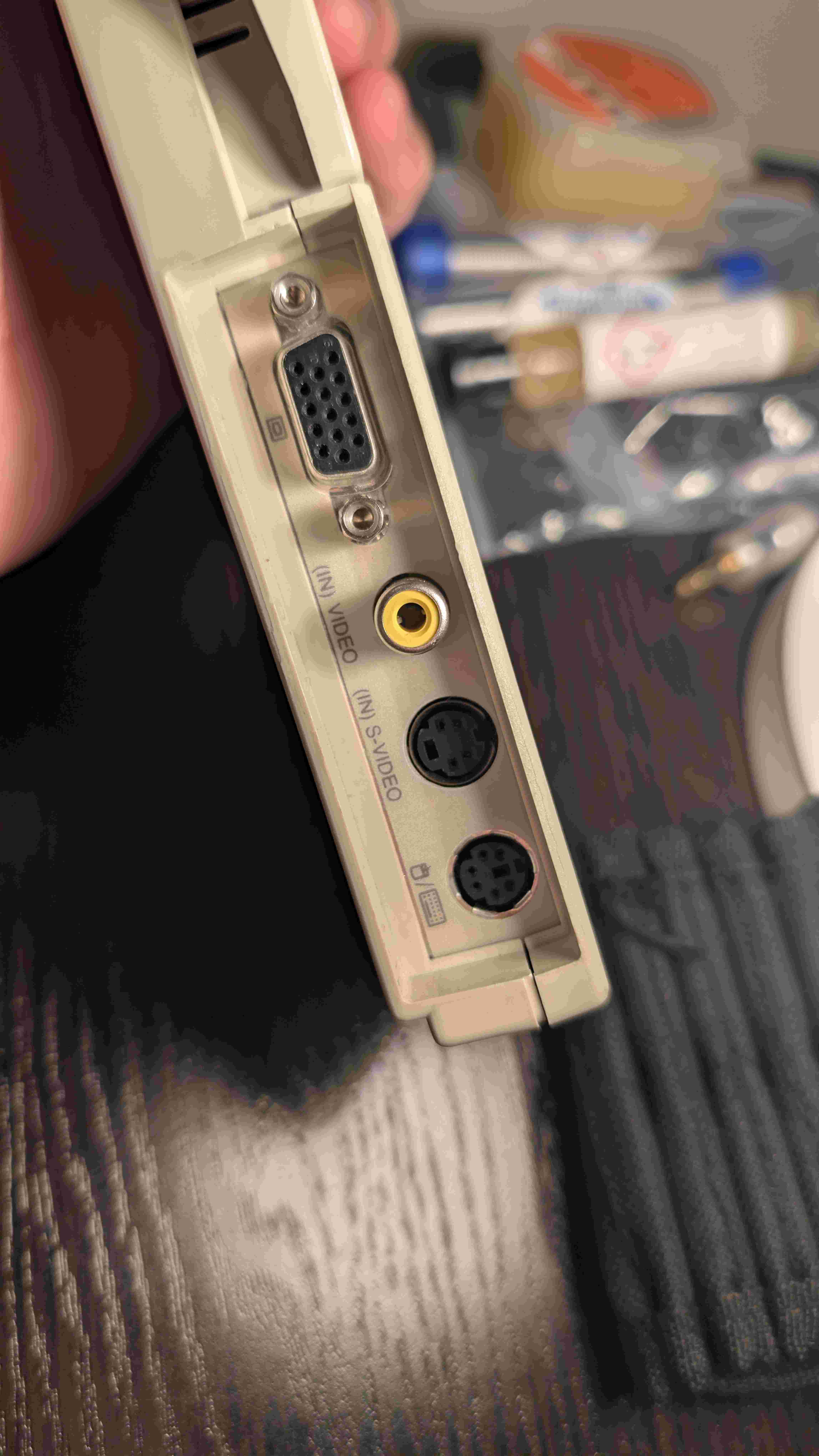 Rear panel showing VGA port, video and S-Video inputs, and PS2 port on the right side